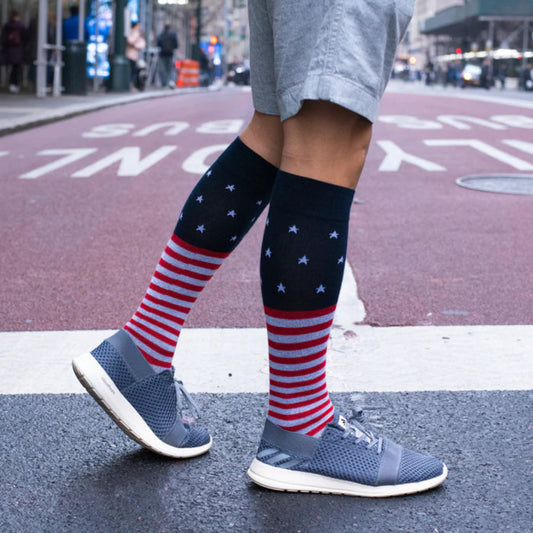 Men wearing knee high compression socks with American flag pattern