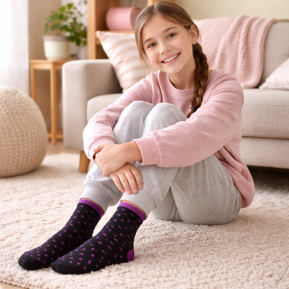 Young Girls wearing colorful novelty crew socks while playing at home