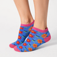 Colorful patterned Ankle socks worn by a person on a white background