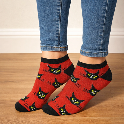 Woman wearing Halloween ankle socks while walking outdoors