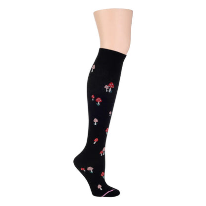 A pair of black compression knee high socks for women with a mushroom pattern.