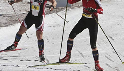 Unisex ski socks worn inside winter boots for skiing and snowboarding in cold weather