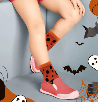 Kids wearing colorful Halloween socks during everyday activities